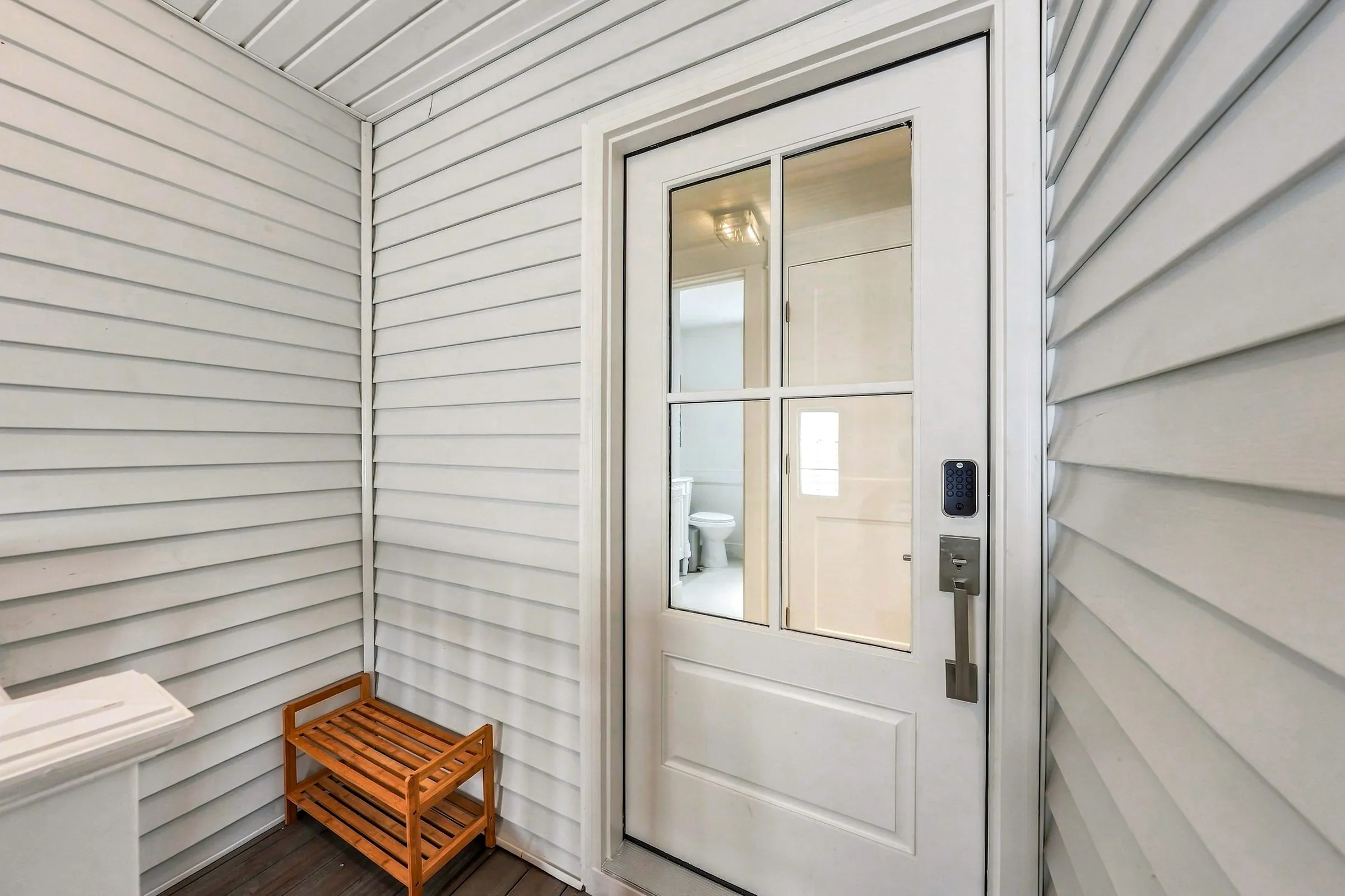 Front door with keypad smart lock for self check-in